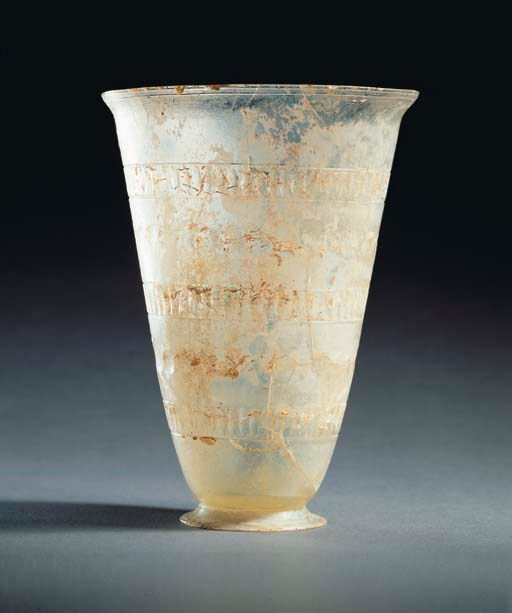 A LARGE ROMAN CLEAR GLASS BEAKER