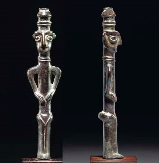 A LURISTAN BRONZE FINIAL OF A VOTIVE MALE FIGURE