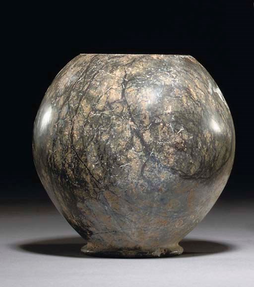 A WESTERN ASIATIC DARK VEINED AND MOTTLED HARDSTONE JAR