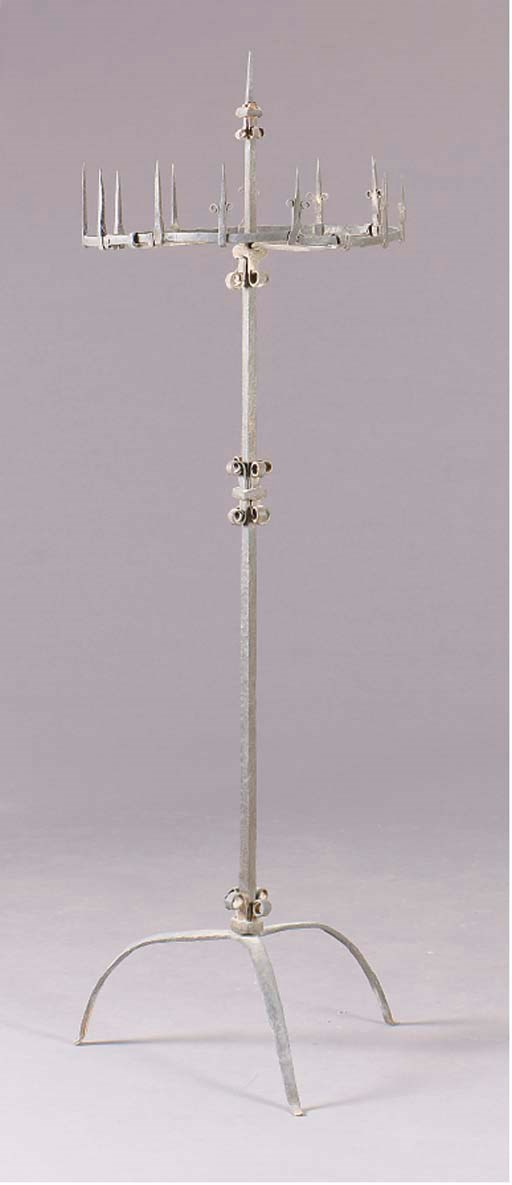 A CONTINENTAL BAROQUE STYLE WROUGHT-IRON TORCHERE