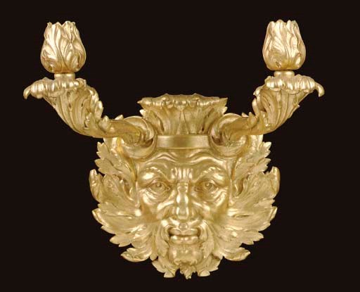 A PAIR OF GILT COMPOSITE LION'S MASK-FORM TWIN-BRANCH WALL LIGHTS,
