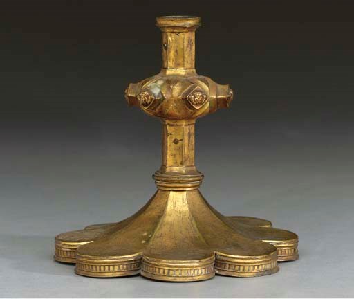 A CONTINENTAL GILT-BRONZE CANDLESTICK,