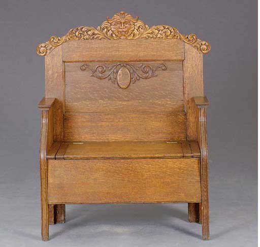AN AMERICAN CARVED OAK HALL BENCH,