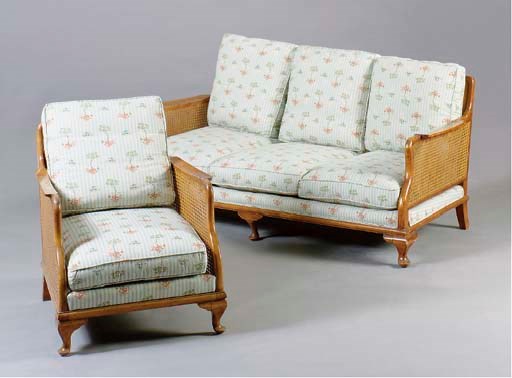 AN EDWARDIAN STYLE CANED SOFA WITH A PAIR OF BERGERES,