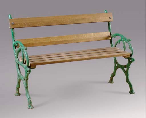 A GREEN PAINTED CAST IRON AND WOOD GARDEN BENCH,