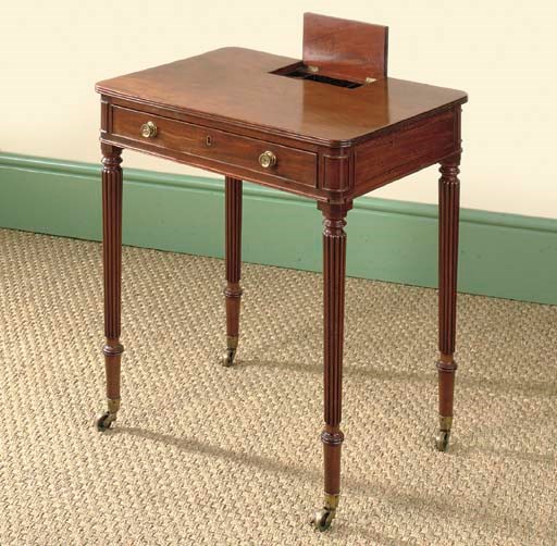 A REGENCY MAHOGANY CHAMBER WRITING-TABLE