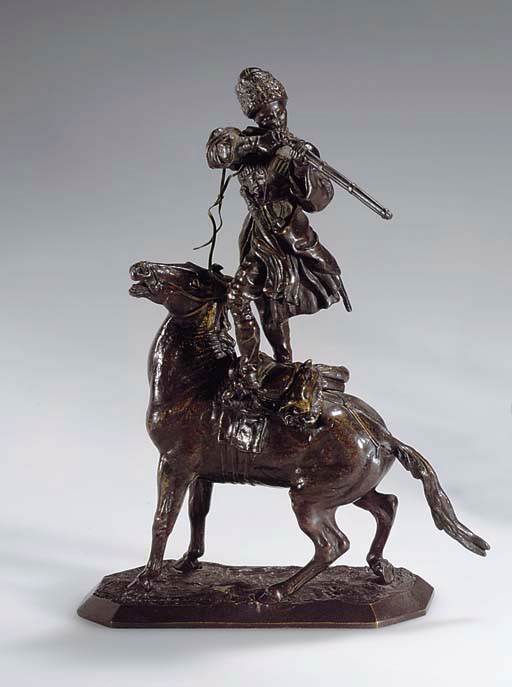 A BRONZE EQUESTRIAN FIGURE
