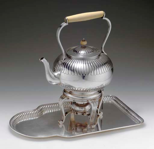 A SILVER TEAPOT AND TRAY