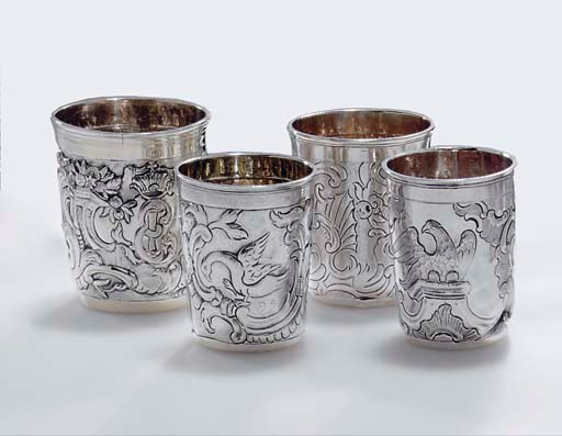 A GROUP OF FOUR SILVER BEAKERS
