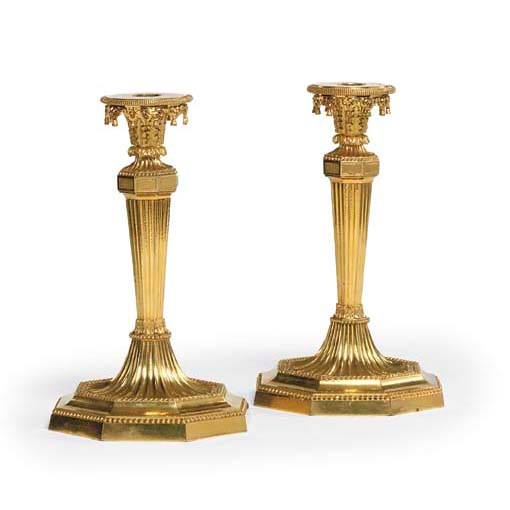 A PAIR OF AUSTRIAN ORMOLU CANDLESTICKS