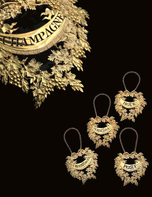 A SET OF FOUR GEORGE III SILVER-GILT WINE-LABELS