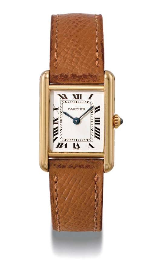Cartier. An 18K gold rectangular wristwatch