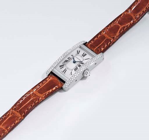 Cartier. A fine 18K white gold and diamond-set rectangular curved wristwatch