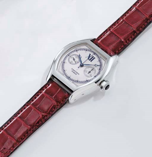 Cartier. A fine 18K white gold tonneau-shaped single button chronograph wristwatch