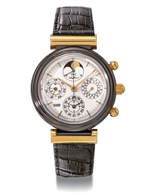 IWC. An unusual 18K gold and black ceramic self-winding perpetual calendar chronograph wristwatch with phases of the moon and year indicator