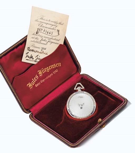 Jules Jürgensen. A fine 18K white gold and enamel openface jump hour keyless lever watch with original certificate and box