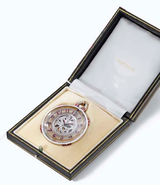Mauboussin. A fine and elegant platinum, rock crystal, ruby and diamond-set skeletonized Art Deco dress watch with original box