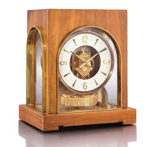 LeCoultre. An unusual gilt and wooden Atmos clock
