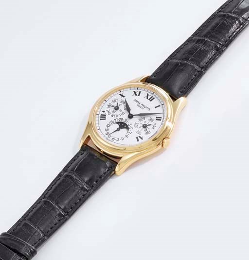 Patek Philippe. A fine 18K gold self-winding perpetual calendar wristwatch with phases of the moon and second dial