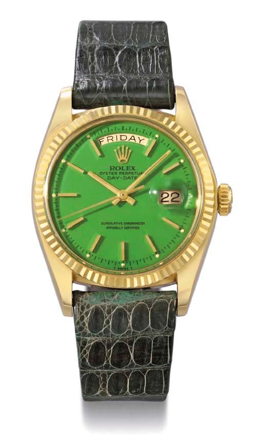 Rolex. An unusual 18K gold self-winding calendar wristwatch with sweep centre seconds and green dial
