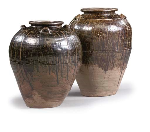 TWO LARGE SOUTH-EAST ASIAN POTTERY STORAGE JARS