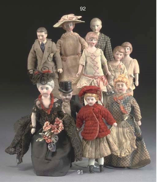 A group of bisque-headed dolls' house dolls