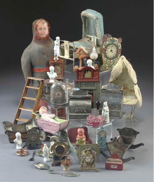 A quantity of tinplate and metal dolls' house furniture