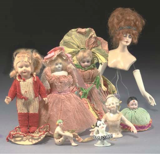 A bisque headed dolls' house doll