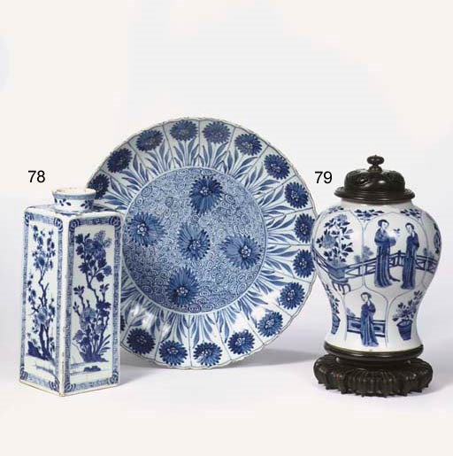 A blue and white jar and a charger