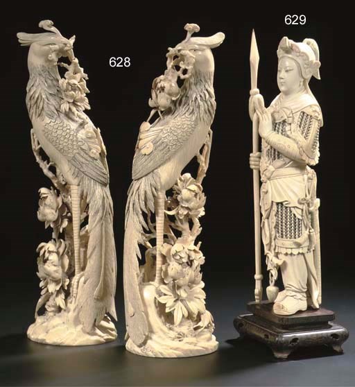 A pair of ivory models of phoenix