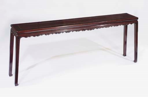A carved lacquered altar table