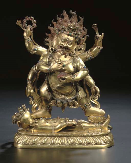 A Tibeto Chinese gilt-bronze figure of Mahakala