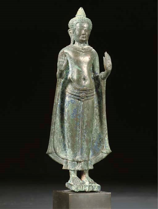 A Khmer-Lopburi bronze figure of Buddha Sakyamuni