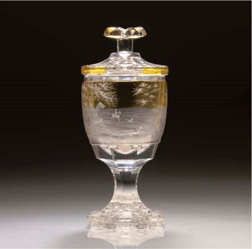 A BOHEMIAN AMBER-FLASH AND ENGRAVED GOBLET AND A COVER