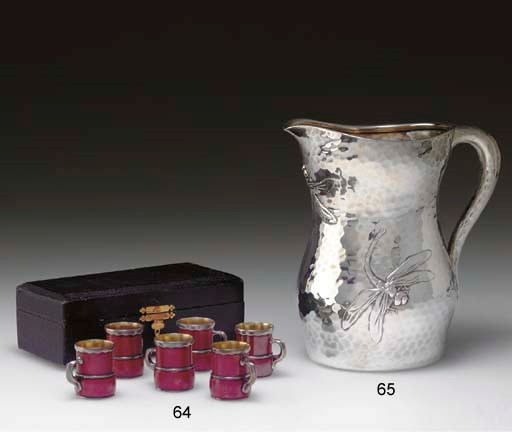 A SET OF SIX SILVER-MOUNTED PATINATED COPPER CUPS