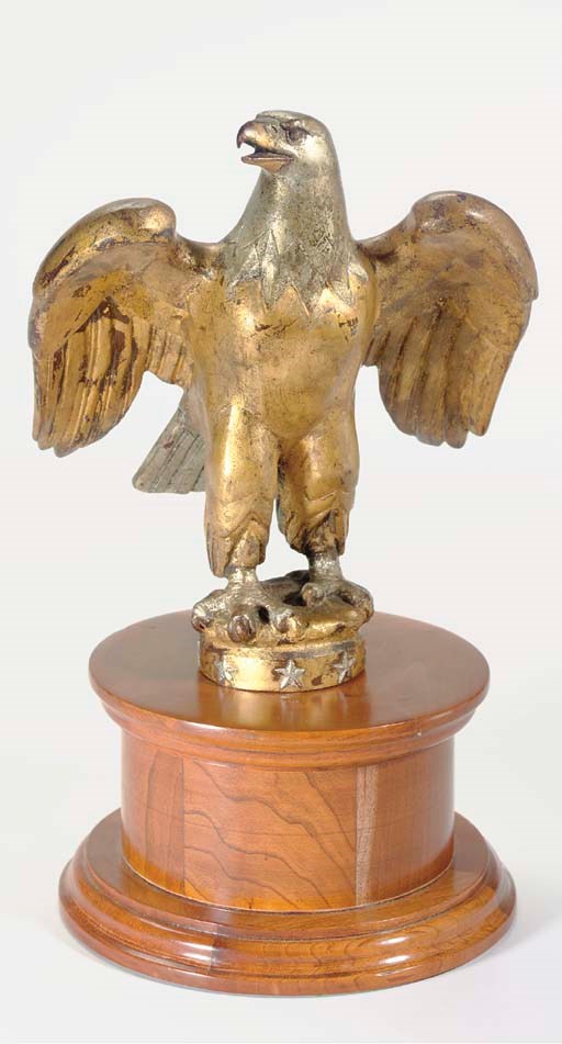 A GILT AND SILVERED BRONZE SPREAD-WING EAGLE