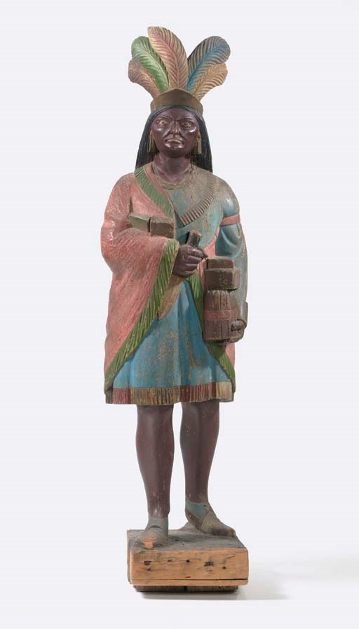 A CARVED AND POLYCHROMED CIGAR STORE INDIAN