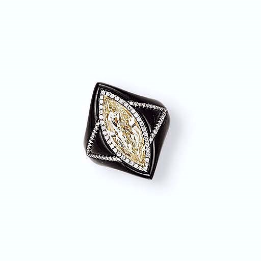 A COLOURED DIAMOND, NEPHRITE AND DIAMOND RING