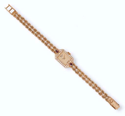 A LADY'S 18K GOLD, DIAMOND AND RUBY WRISTWATCH, BY CHOPARD