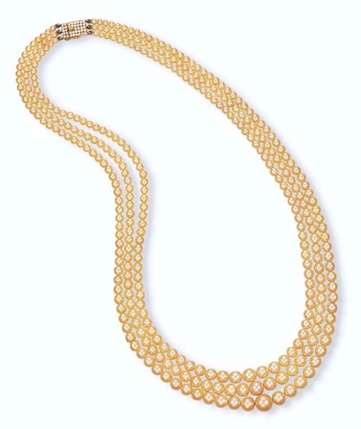 A THREE-STRAND NATURAL PEARL NECKLACE