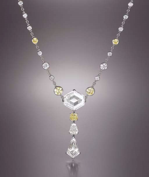 AN UNIQUE DIAMOND AND COLOURED DIAMOND PENDANT NECKLACE, BY CARTIER