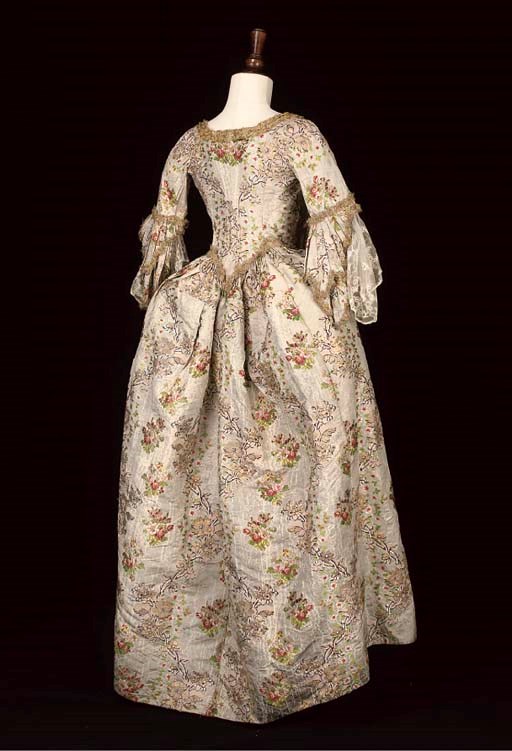 A SILVER GROUND BROCADED OPEN ROBE, 18TH CENTURY WITH LATER ALTERATIONS