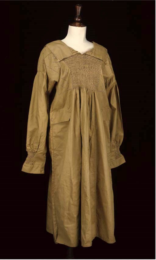 A MUSTARD YELLOW LABOURER'S SMOCK