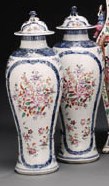 A PAIR OF FAMILLE ROSE AND UNDERGLAZE BLUE VASES AND COVERS