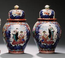 A PAIR OF JAPANESE PORCELAIN VASES AND COVERS