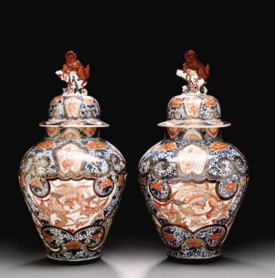 A LARGE PAIR OF JAPANESE ARITA VASES AND COVERS