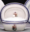 AN ARMORIAL BUTTER TUB AND COVER