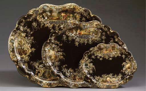 A SET OF THREE VICTORIAN PAPIER MACHE TRAYS