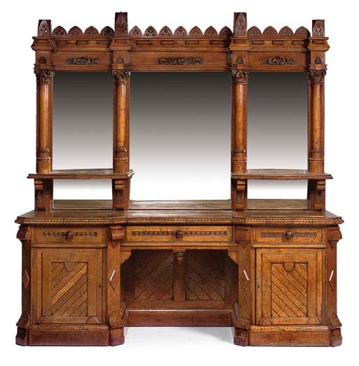 A MID-VICTORIAN POLLARD OAK BREAKFRONT SIDEBOARD