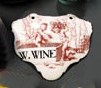 A BATTERSEA ENAMEL WINE LABEL